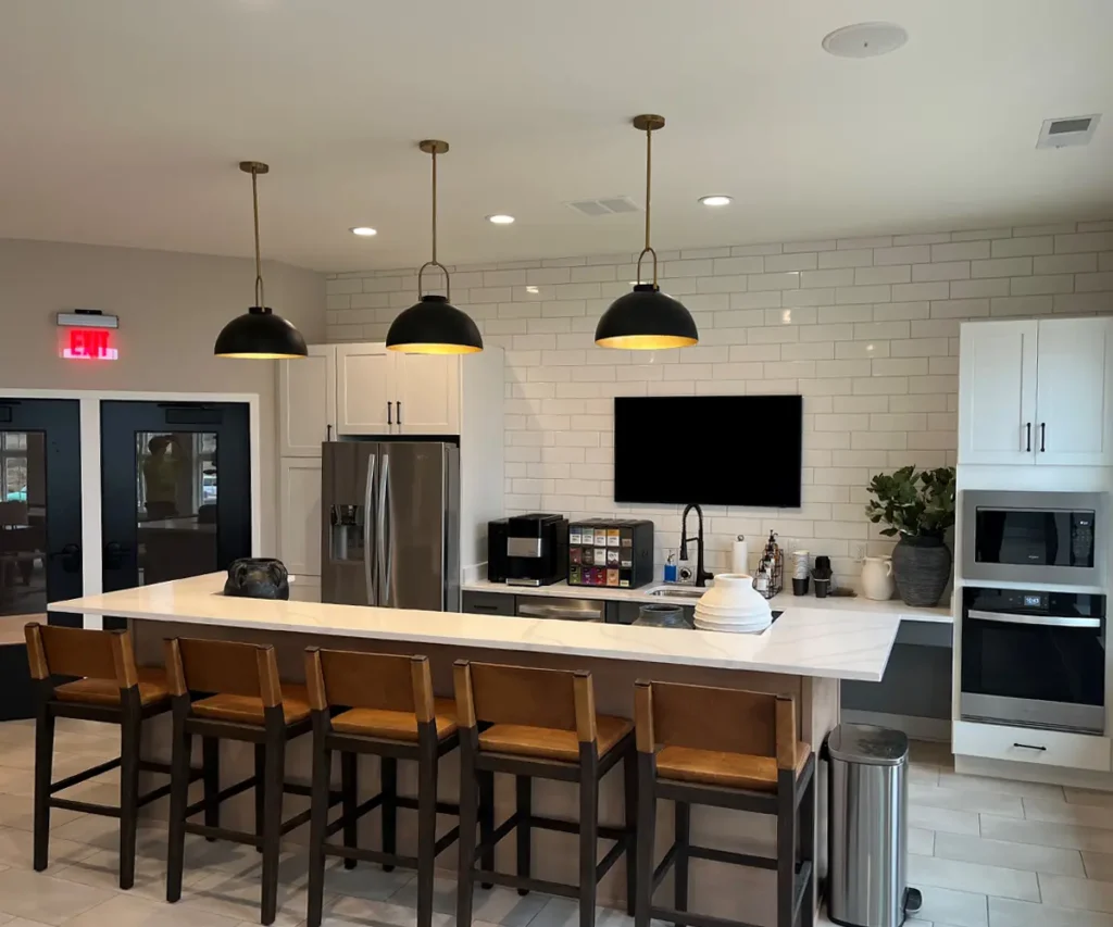 kitchen with newly installed appliances and lighting